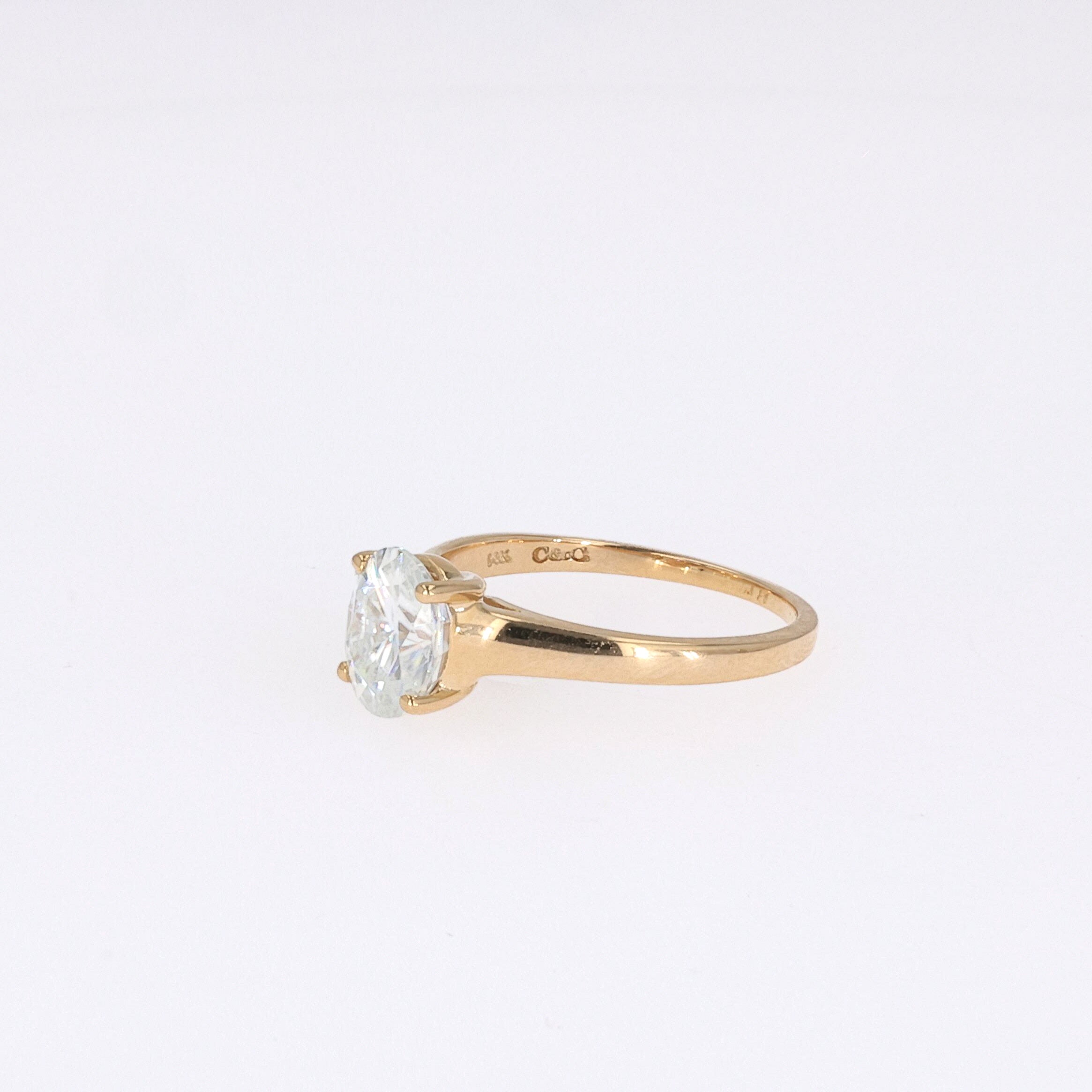 1.50 CTW DEW Oval Near-Colorless Moissanite Solitaire Ring in 14K Yellow Gold