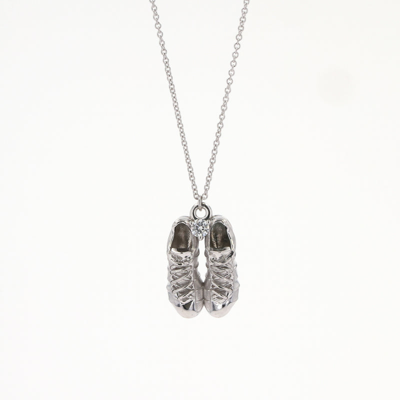 0.10 CTW DEW Round Near-Colorless Moissanite Pendant in Sterling Silver